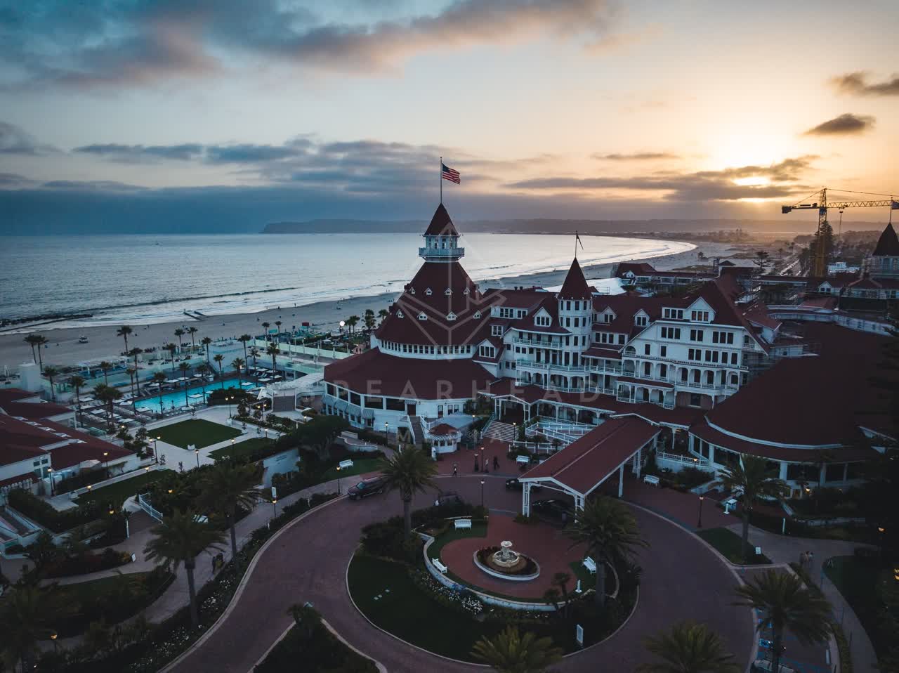 Aerial view of the beach, palm trees and the ocean at Coronado Beach.