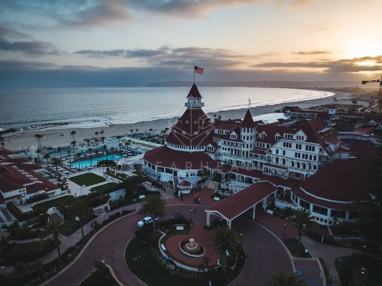 Aerial view of the beach, palm trees and the ocean at Coronado Beach.