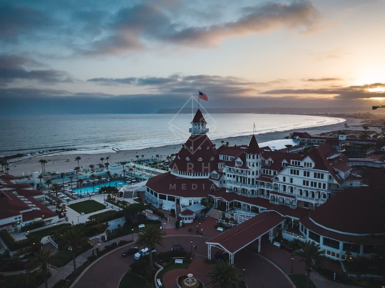 Aerial view of the beach, palm trees and the ocean at Coronado Beach.