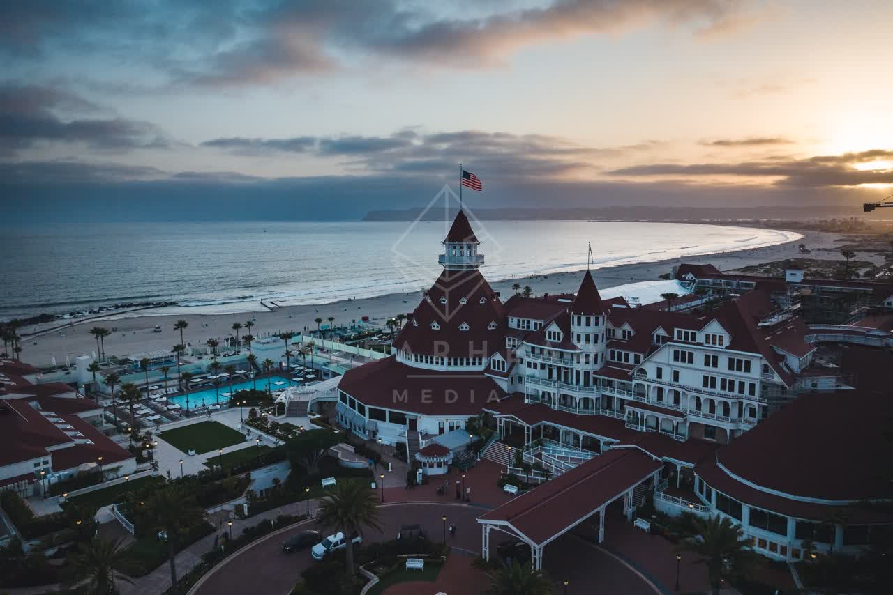 Aerial view of the beach, palm trees and the ocean at Coronado Beach.