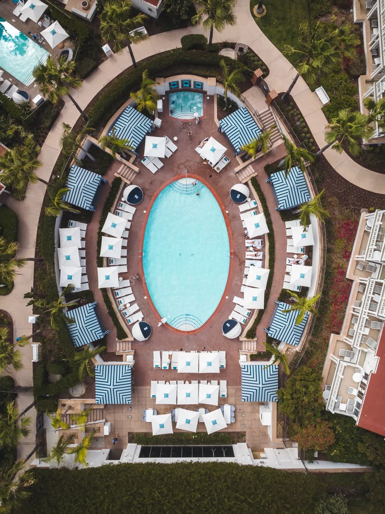 Aerial view of the beach, palm trees and the buildings at Coronado Beach.