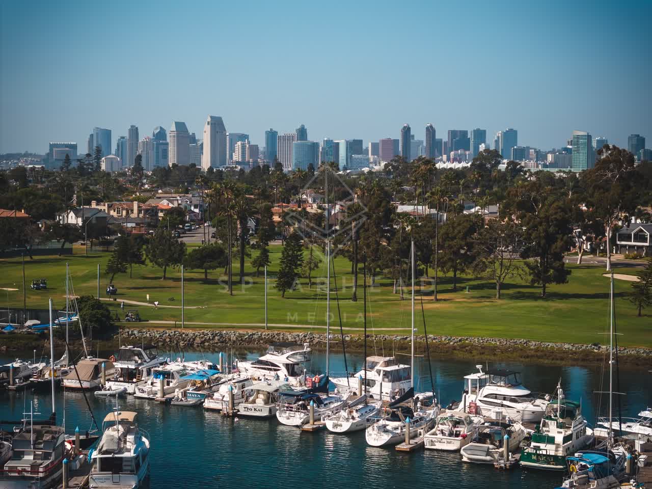 Aerial view of the harbor, the skyline and boats at Coronado Beach, with boats out.