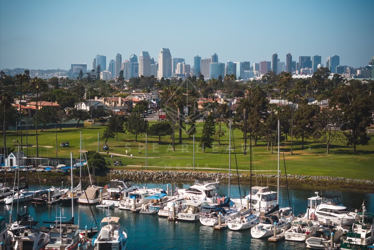 Aerial view of the harbor, the skyline and boats at Coronado Beach, with boats out.