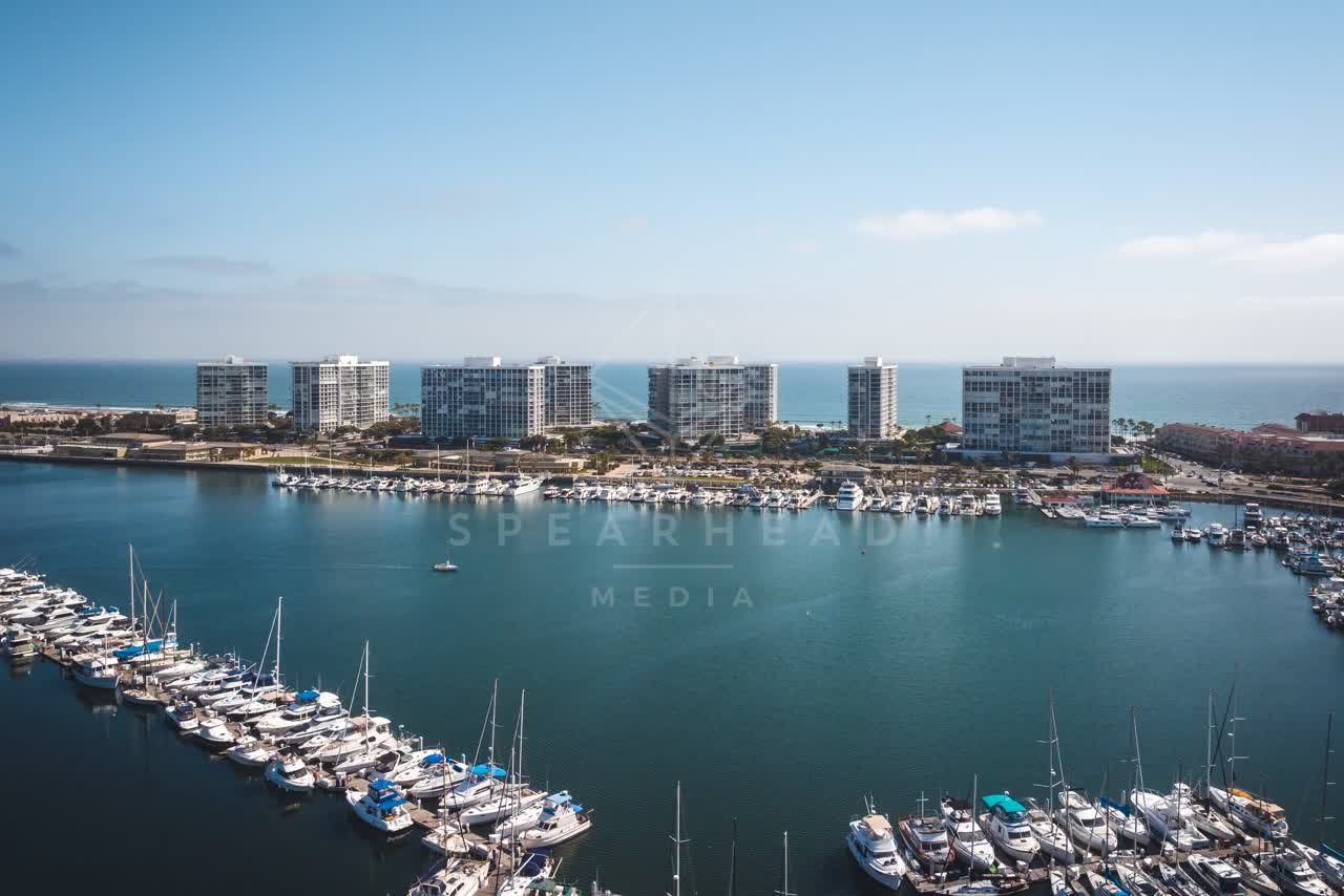 Aerial view of the harbor, boats and the bay at Coronado Beach, with boats out.