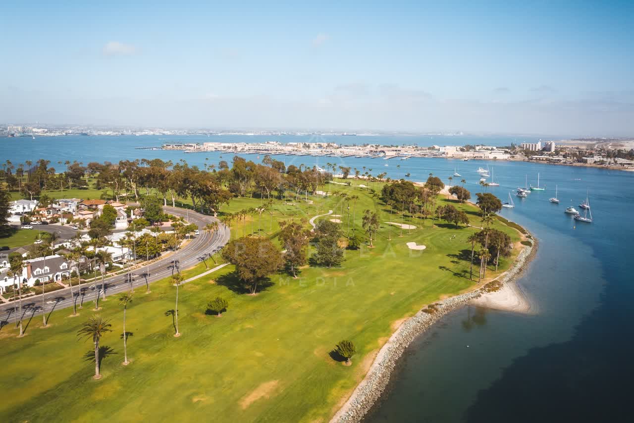 Aerial view of a park, boats and palm trees at Coronado Beach.