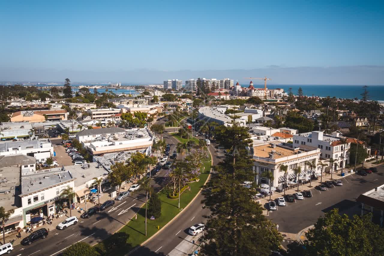 Aerial view of the downtown streets, palm trees and the ocean in Coronado.