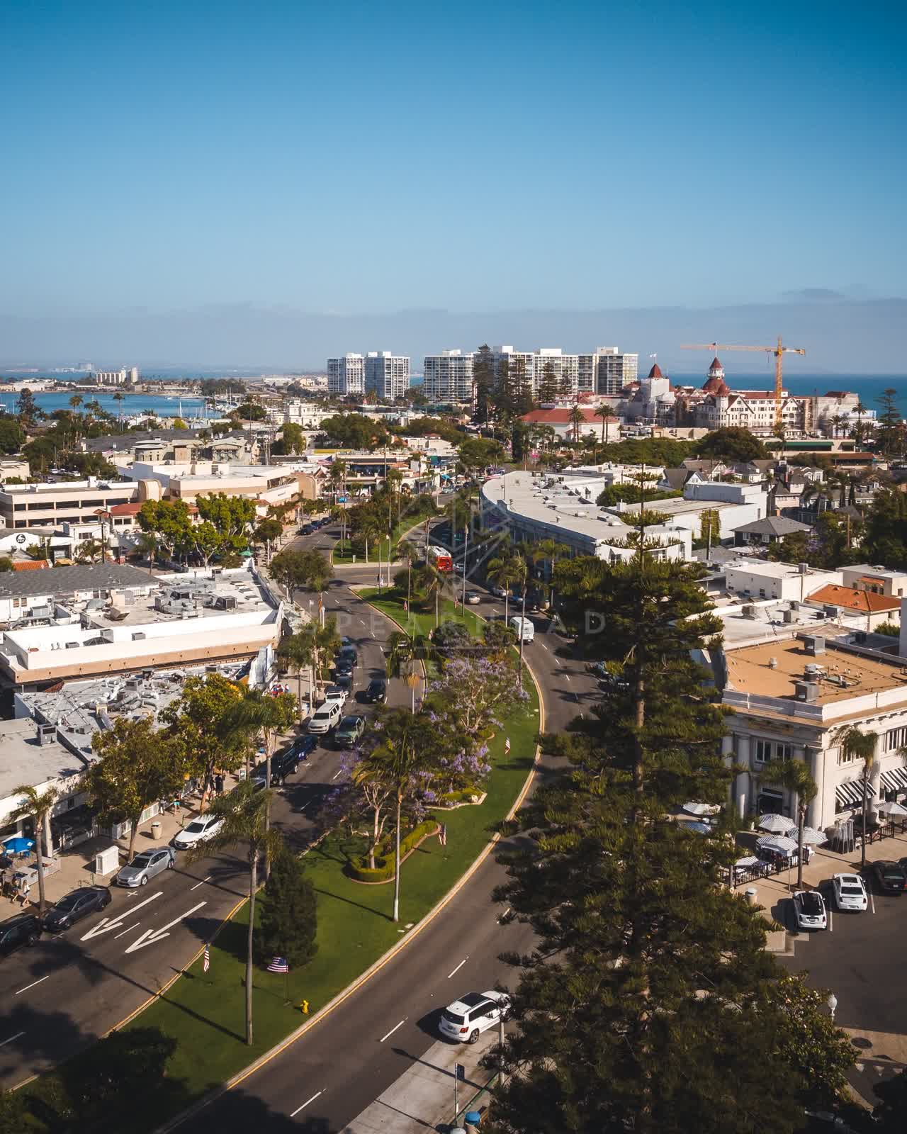 Aerial view of the downtown streets, palm trees and the ocean in Coronado.