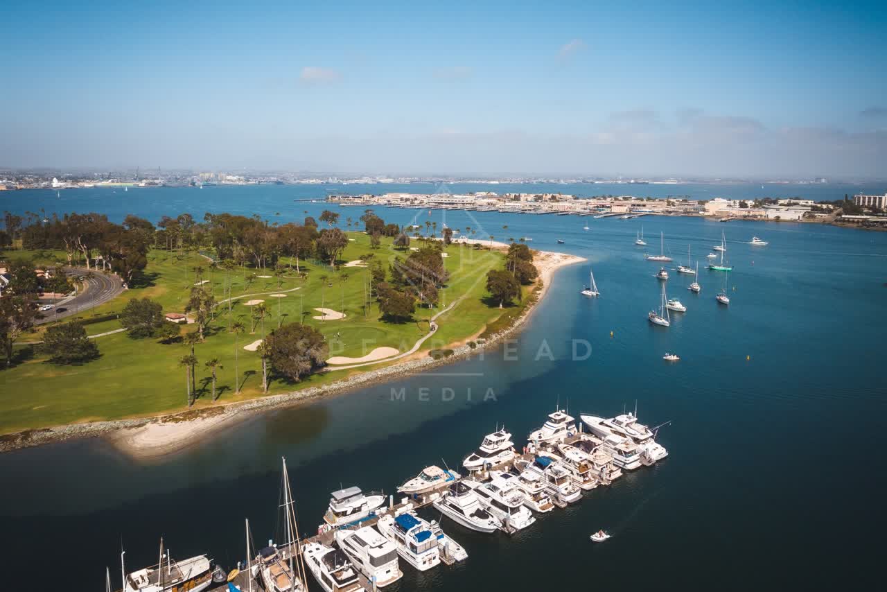 Aerial view of the harbor, boats and the bay at Coronado Beach, with boats out.