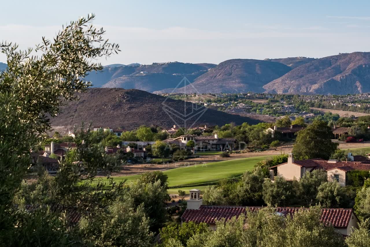 Elevated view of a residential street, homes and the buildings in Santaluz.