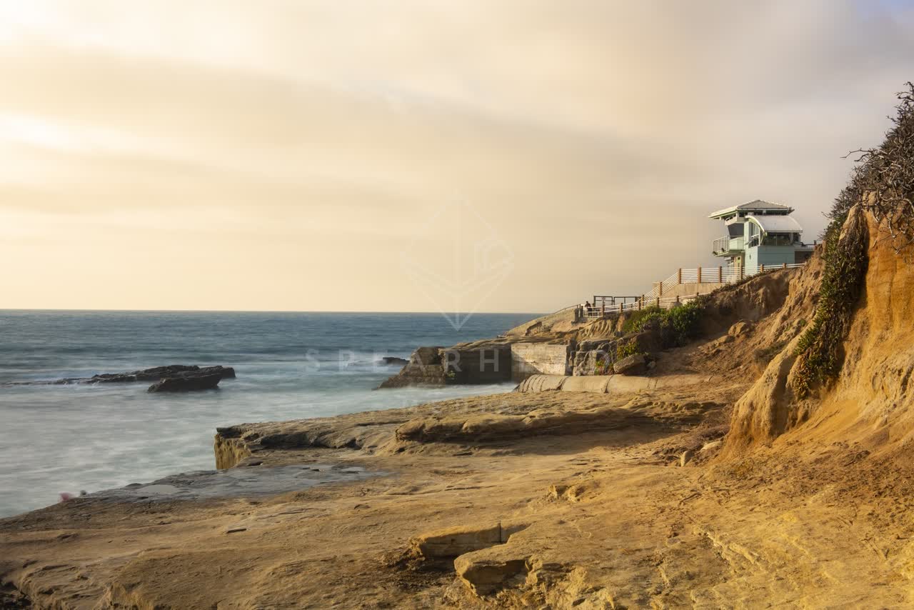 Elevated view of the cliffs, the ocean and open country at La Jolla Cove.