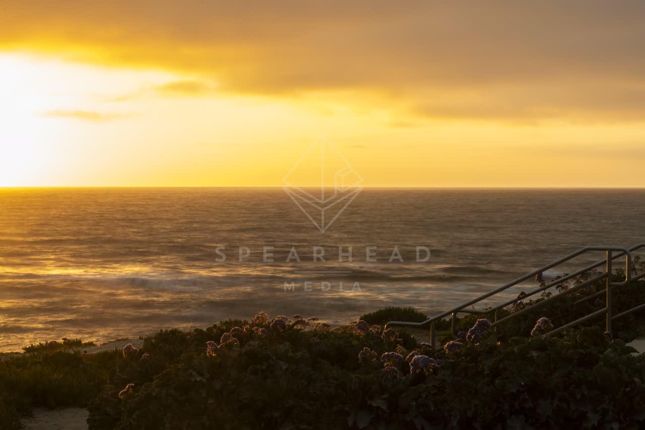 Elevated view of the cliffs, the surf and the ocean at La Jolla Cove.