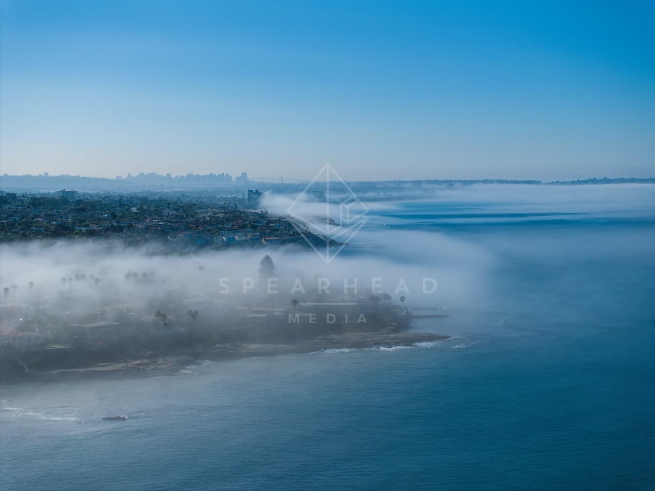 Aerial view of the cliffs, the skyline and palm trees at Lower Hermosa.
