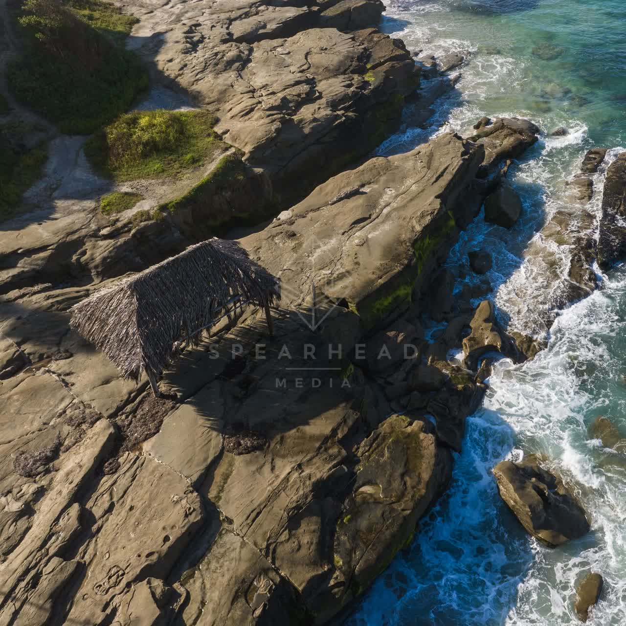 Aerial view of the cliffs, the surf and the ocean at Windansea.