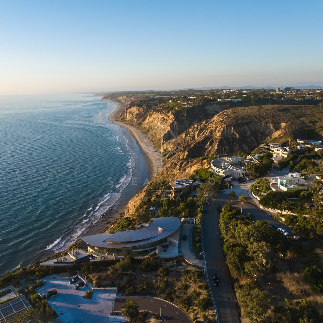 Aerial view of the cliffs, the ocean and homes at Black’s Beach.