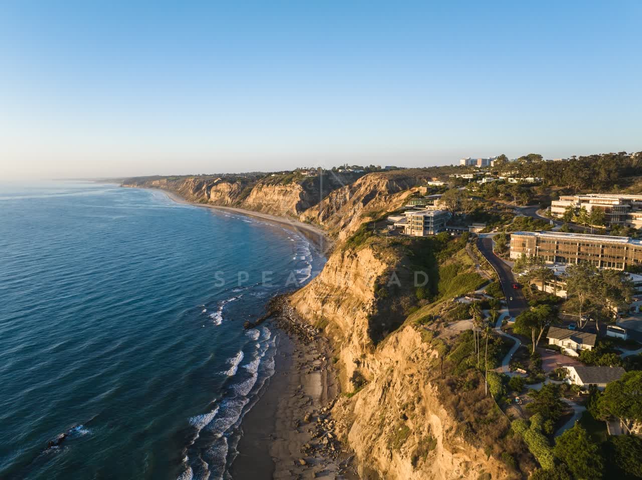 Aerial view of the cliffs, the ocean and homes at Black’s Beach.