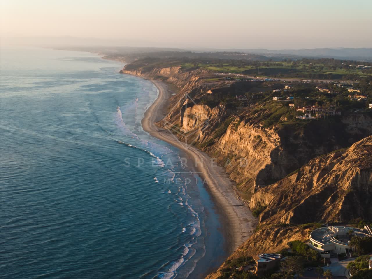 Aerial view of the cliffs, the ocean and homes at Black’s Beach.