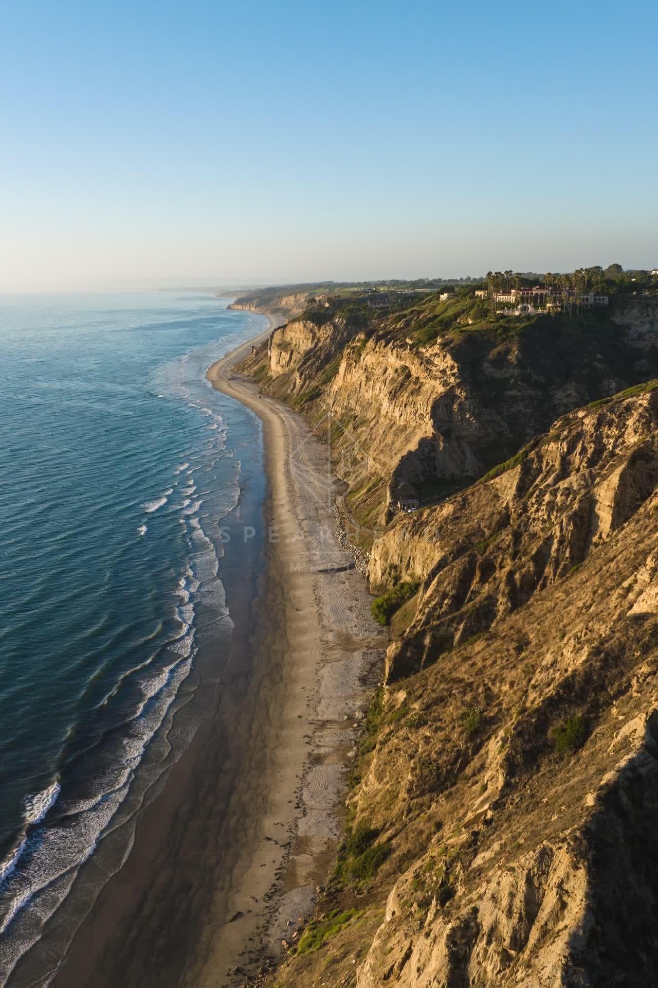 Aerial view of the cliffs, the ocean and homes at Black’s Beach.