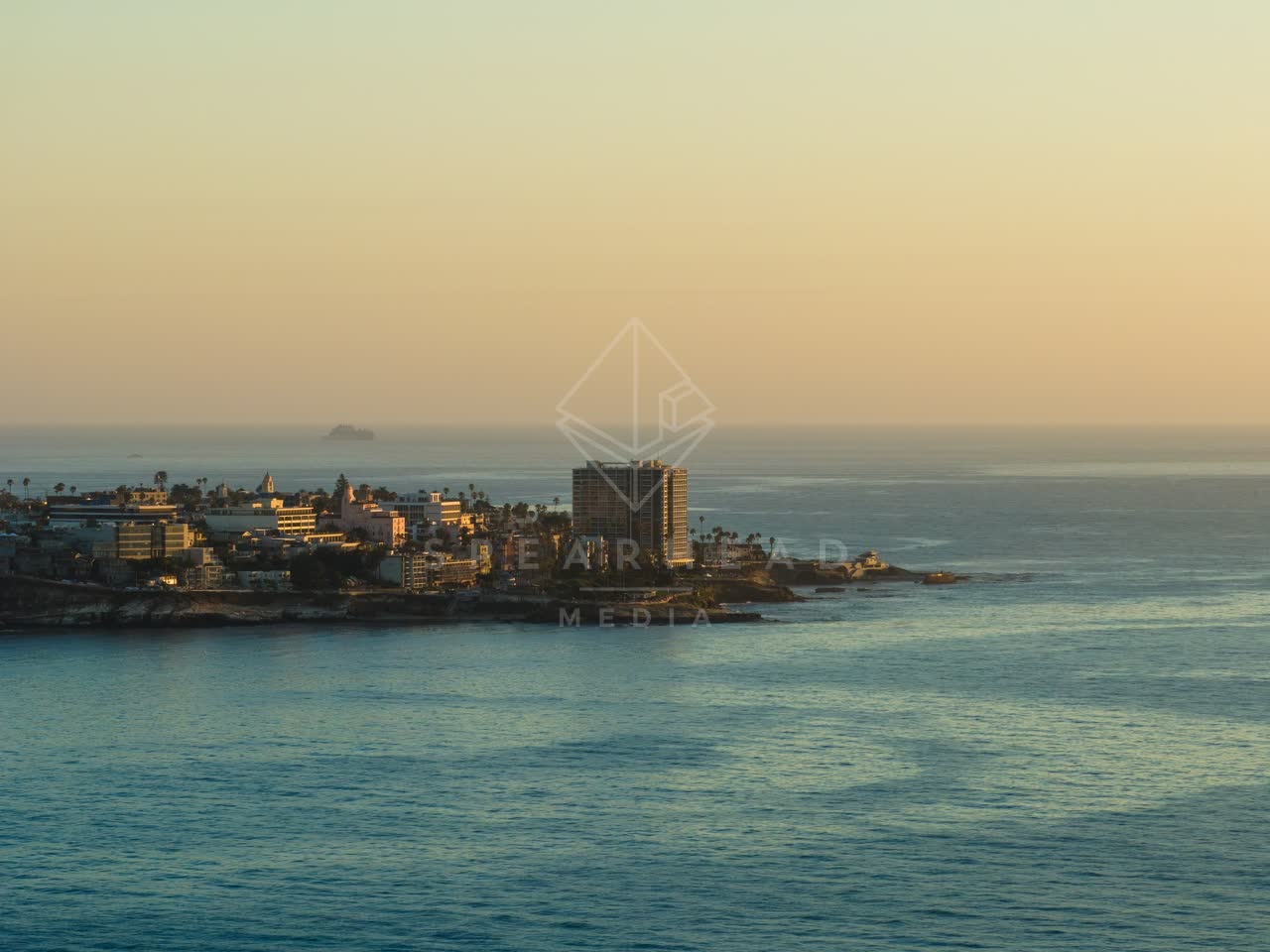 Aerial view of the cliffs, the ocean and homes at La Jolla Cove.