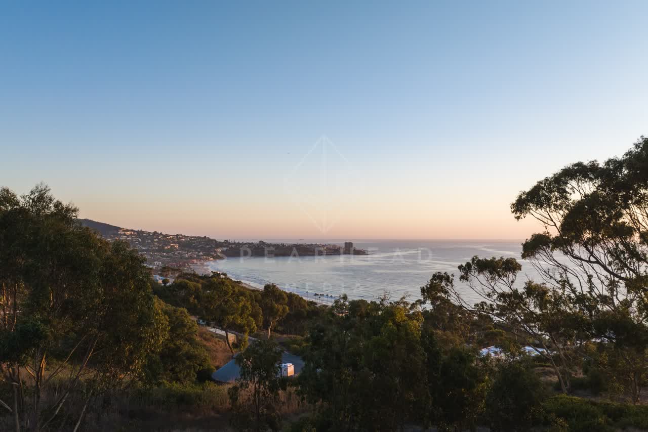 Elevated view of the cliffs, the pier and the ocean at La Jolla Shores.