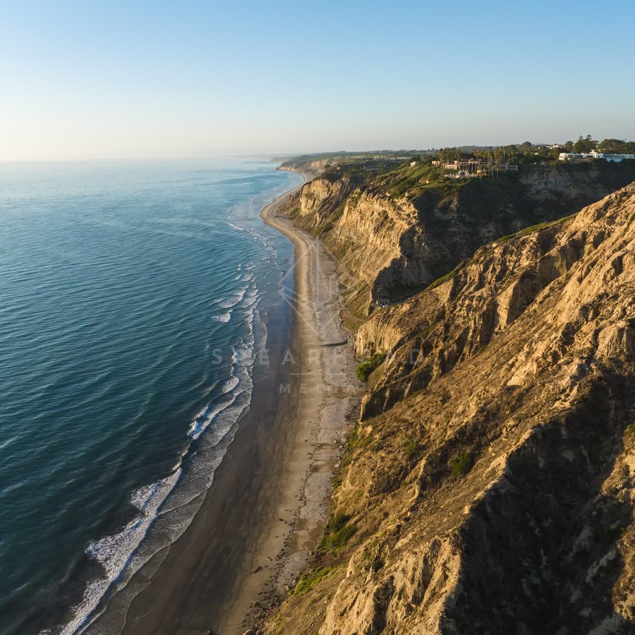 Aerial view of the cliffs, the ocean and homes at Black’s Beach.