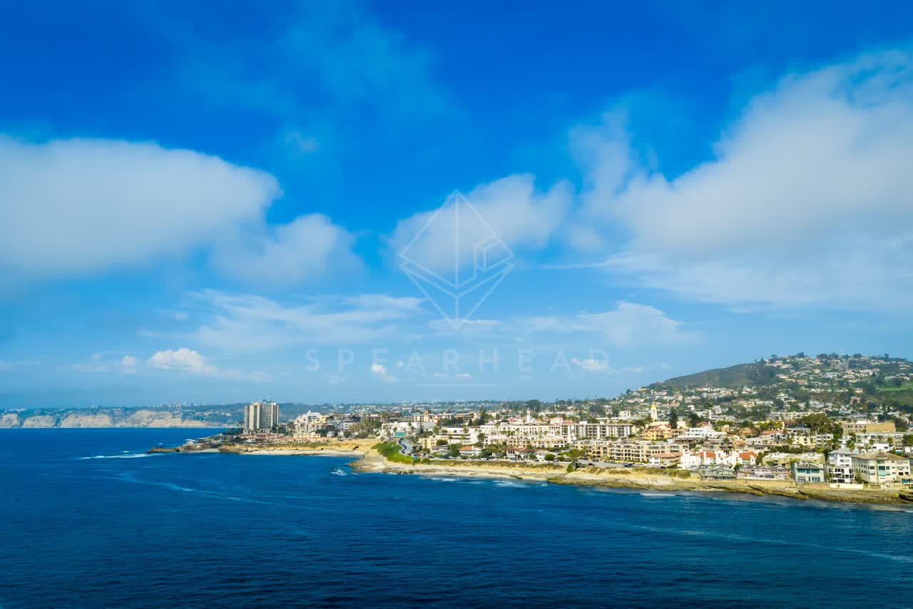 Aerial view of the beach, boats and the ocean at La Jolla Cove.