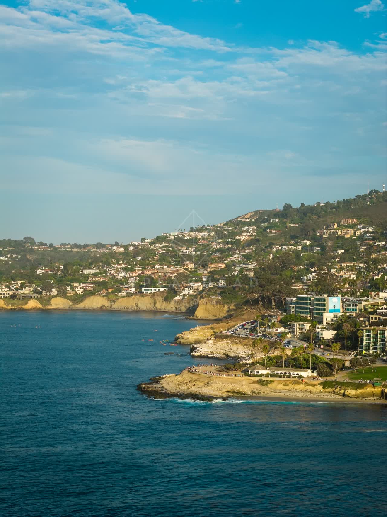 Aerial view of the cliffs, the ocean and homes at La Jolla Cove.