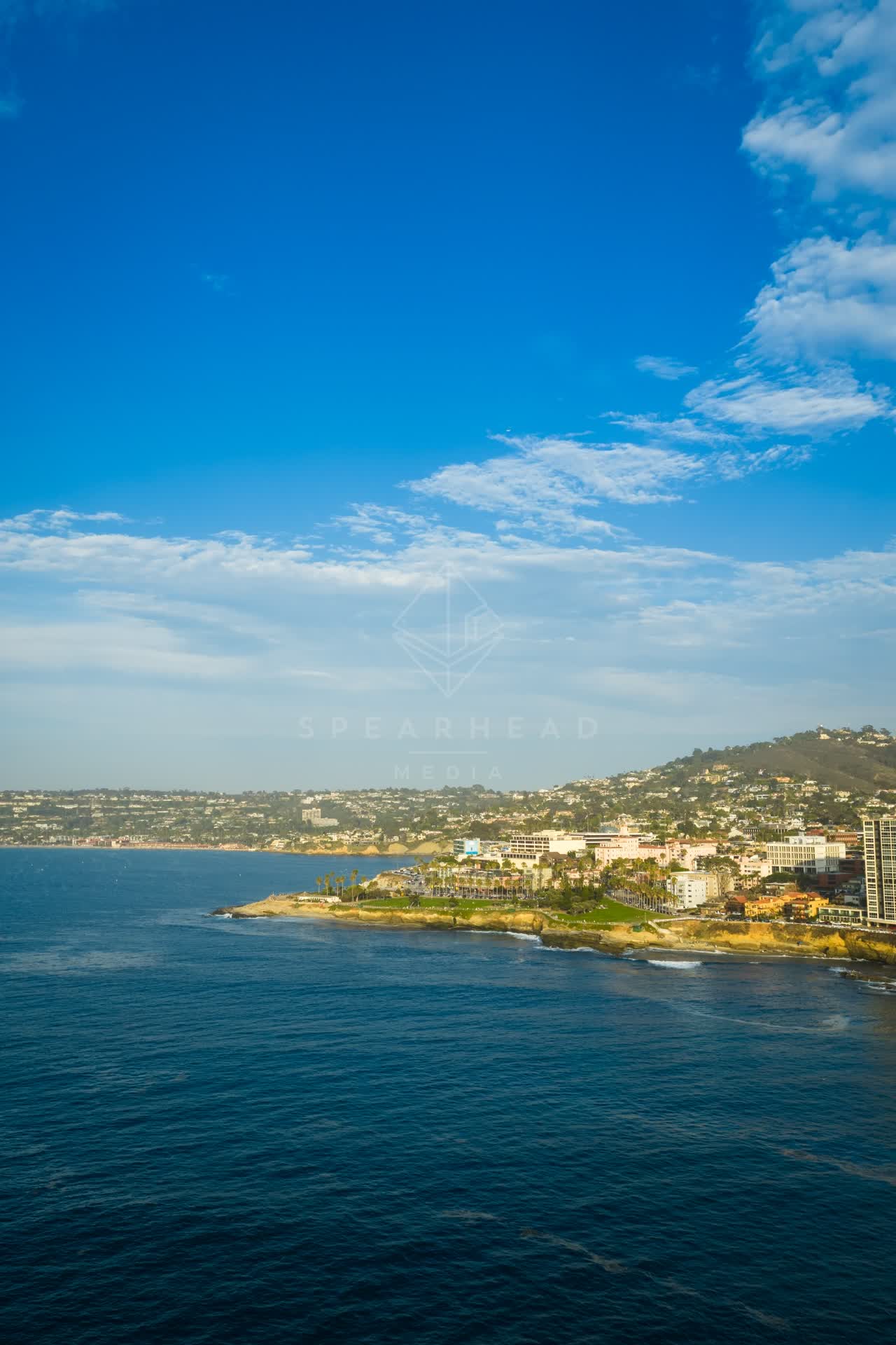 Aerial view of the cliffs, the ocean and homes at La Jolla Cove.