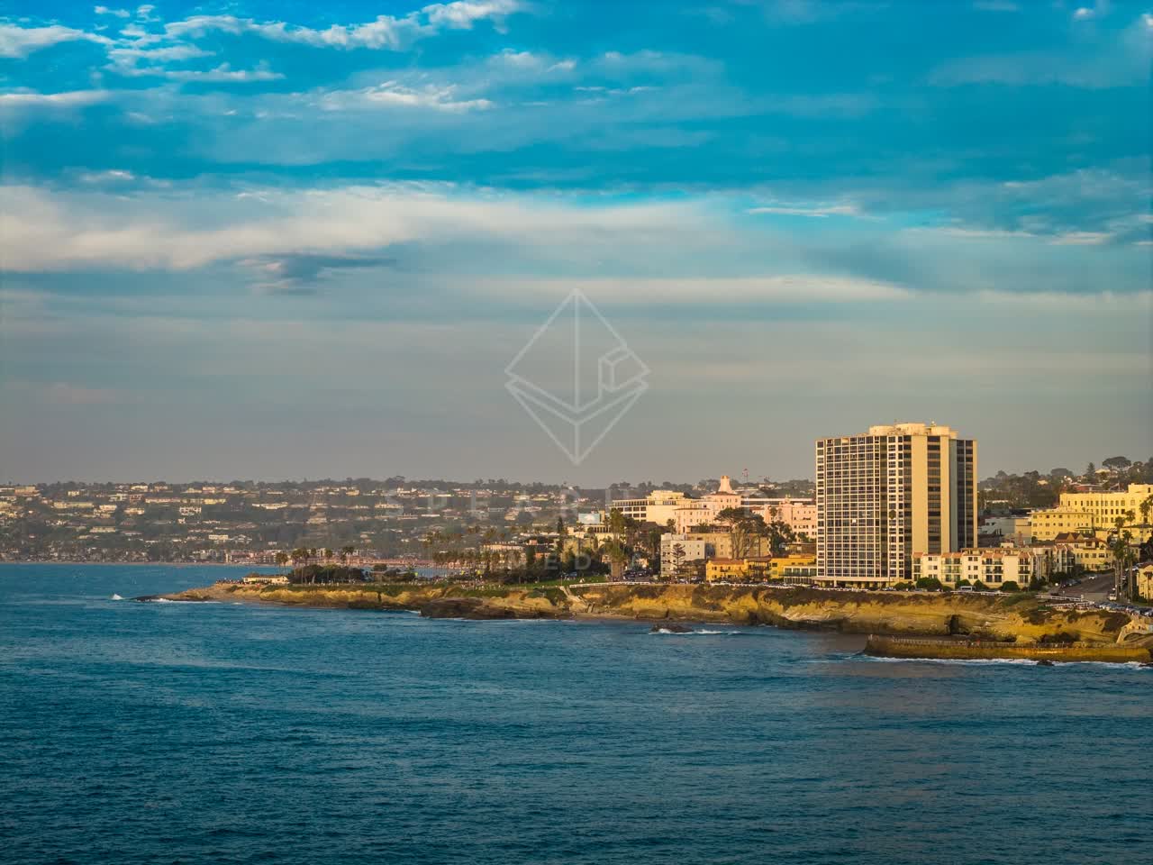 Aerial view of the cliffs, the ocean and homes at La Jolla Cove.
