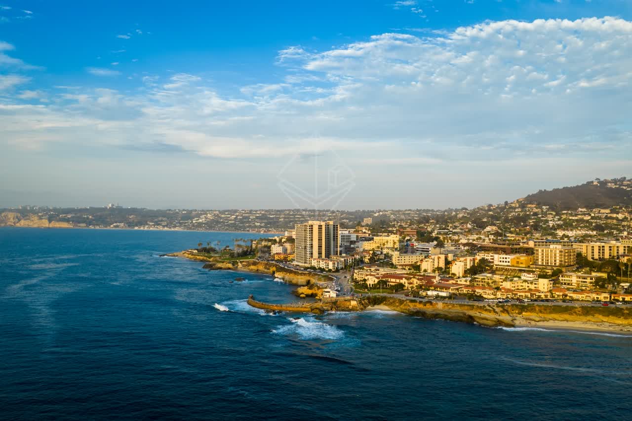 Aerial view of the cliffs, the surf and the ocean at Village of La Jolla.