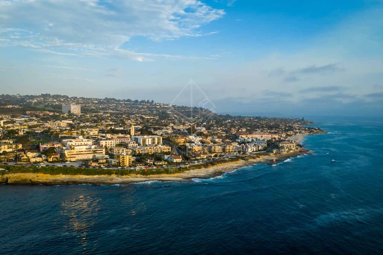 Aerial view of the cliffs, the ocean and homes at La Jolla Cove.