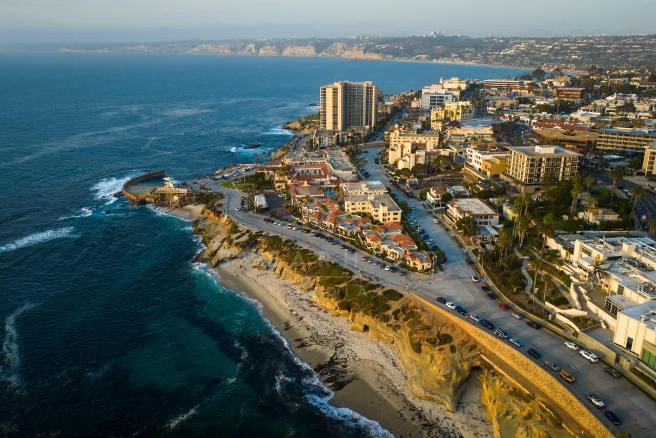 Aerial view of the cliffs, the surf and the ocean at Village of La Jolla.
