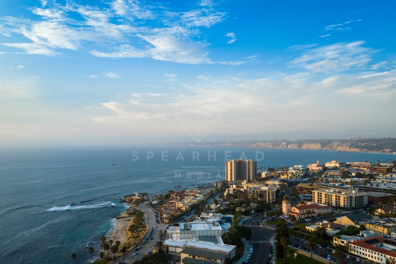 Aerial view of the cliffs, the surf and the ocean at Village of La Jolla.