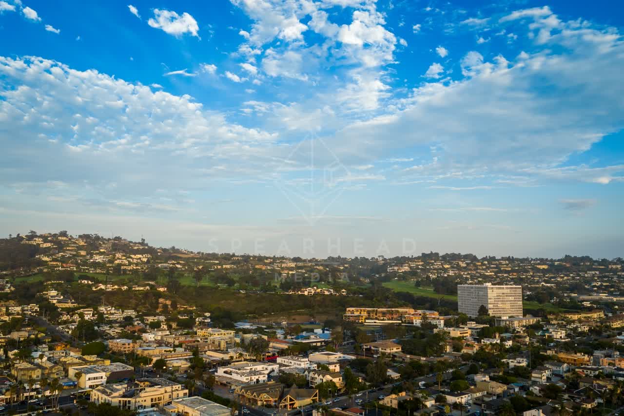 Aerial view of a residential street, homes and the buildings at La Jolla Cove.