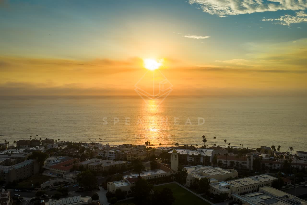 Aerial view of the beach, palm trees and the ocean at Village of La Jolla.