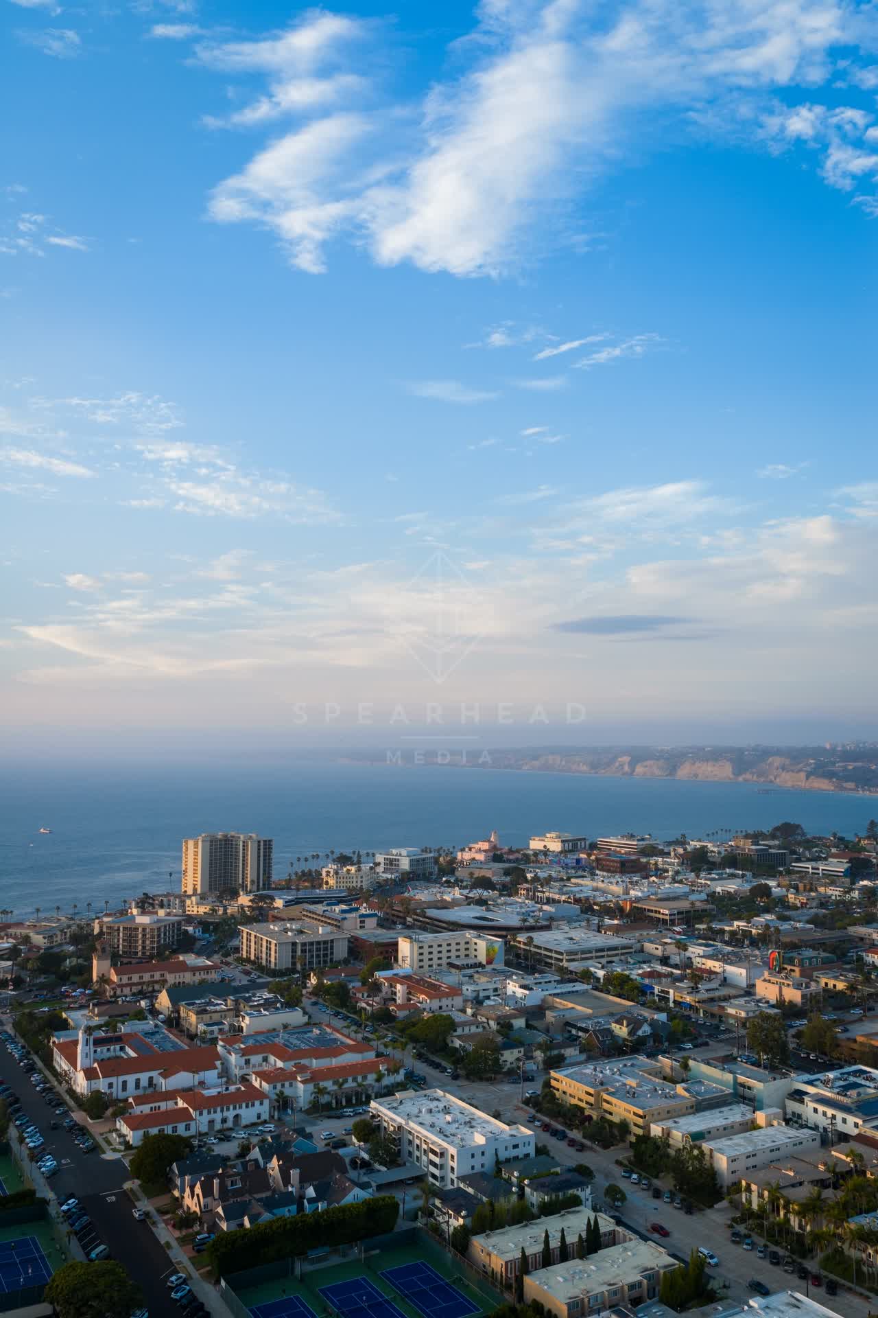 Aerial view of the downtown streets, the ocean and homes at La Jolla Cove.
