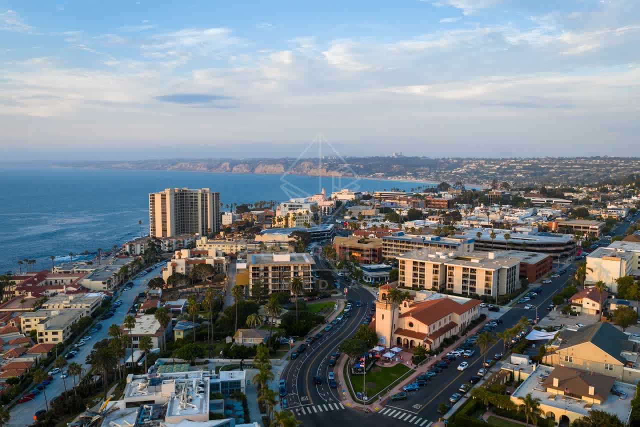 Aerial view of the downtown streets, palm trees and the ocean at La Jolla Cove.