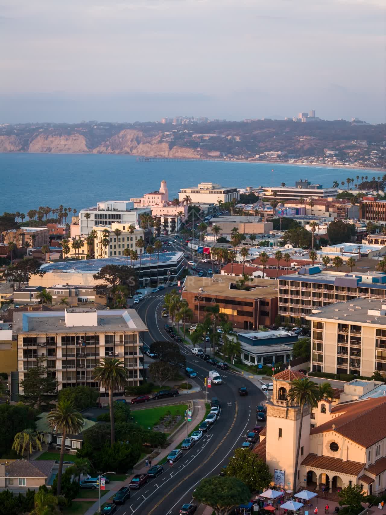 Aerial view of the downtown streets, palm trees and the ocean at La Jolla Cove.