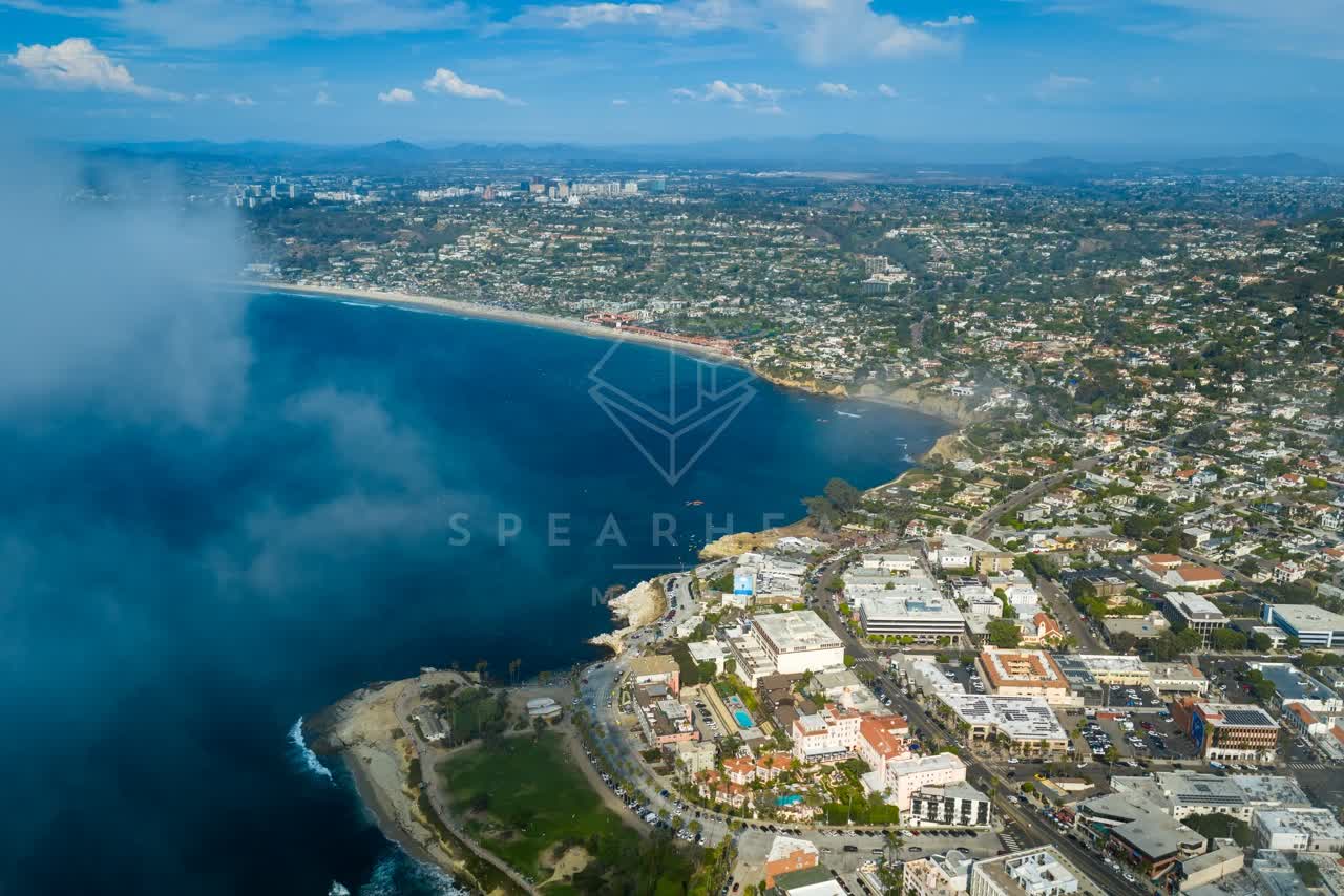 Aerial view of the cliffs, the ocean and the bay at La Jolla Cove.
