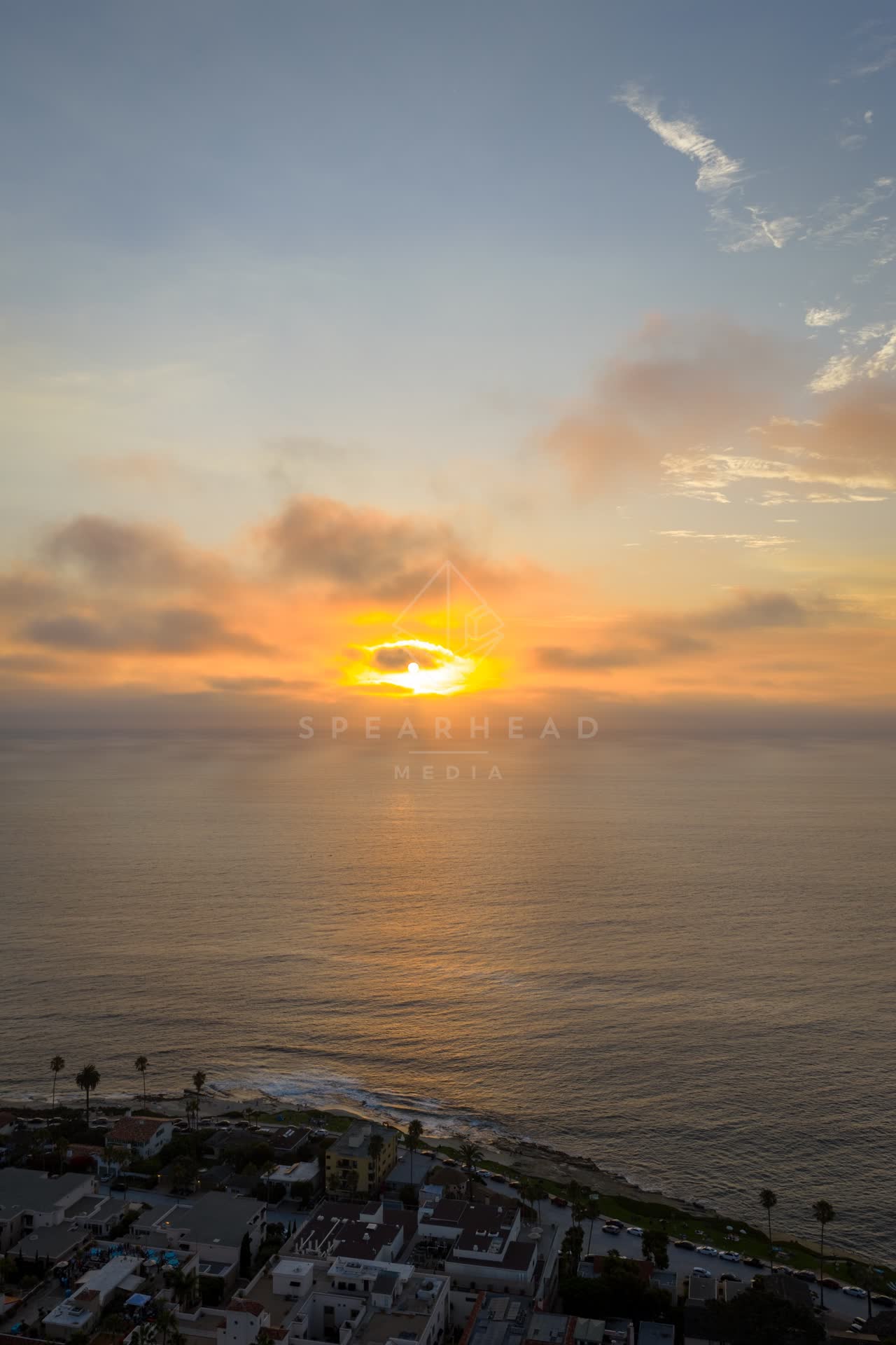 Aerial view of the cliffs, palm trees and the ocean at Village of La Jolla.