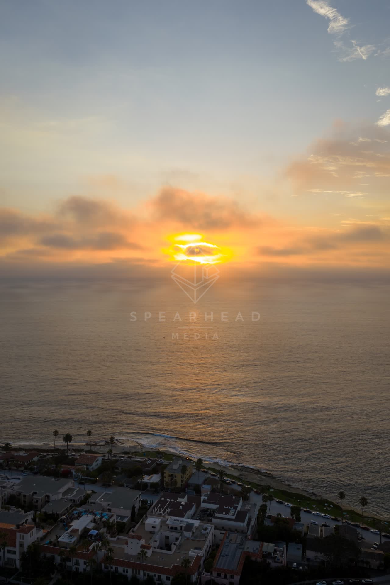 Aerial view of the cliffs, the ocean and homes at Village of La Jolla.