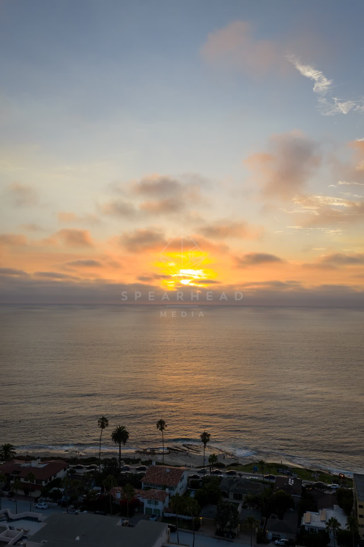 Aerial view of the beach, palm trees and the ocean at Village of La Jolla.