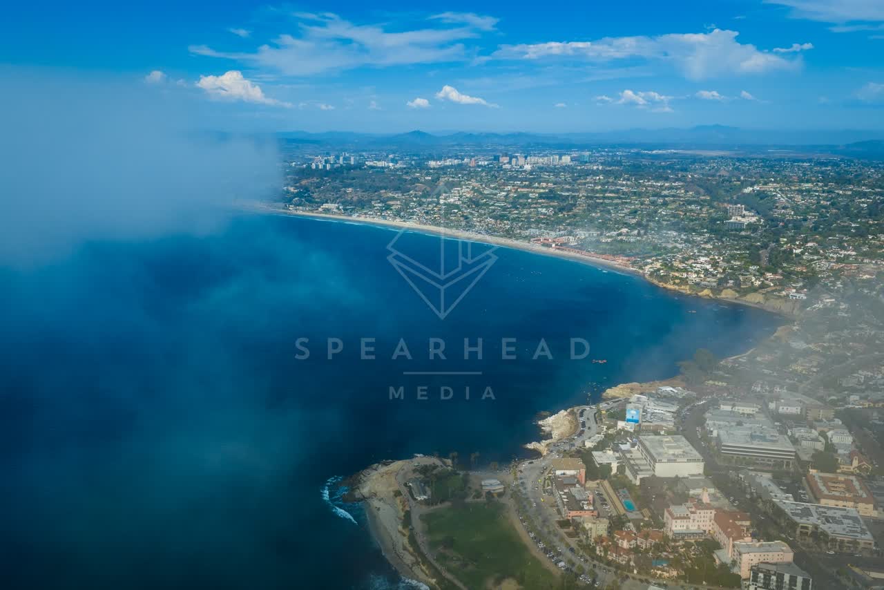 Aerial view of the cliffs, the ocean and homes at La Jolla Cove.