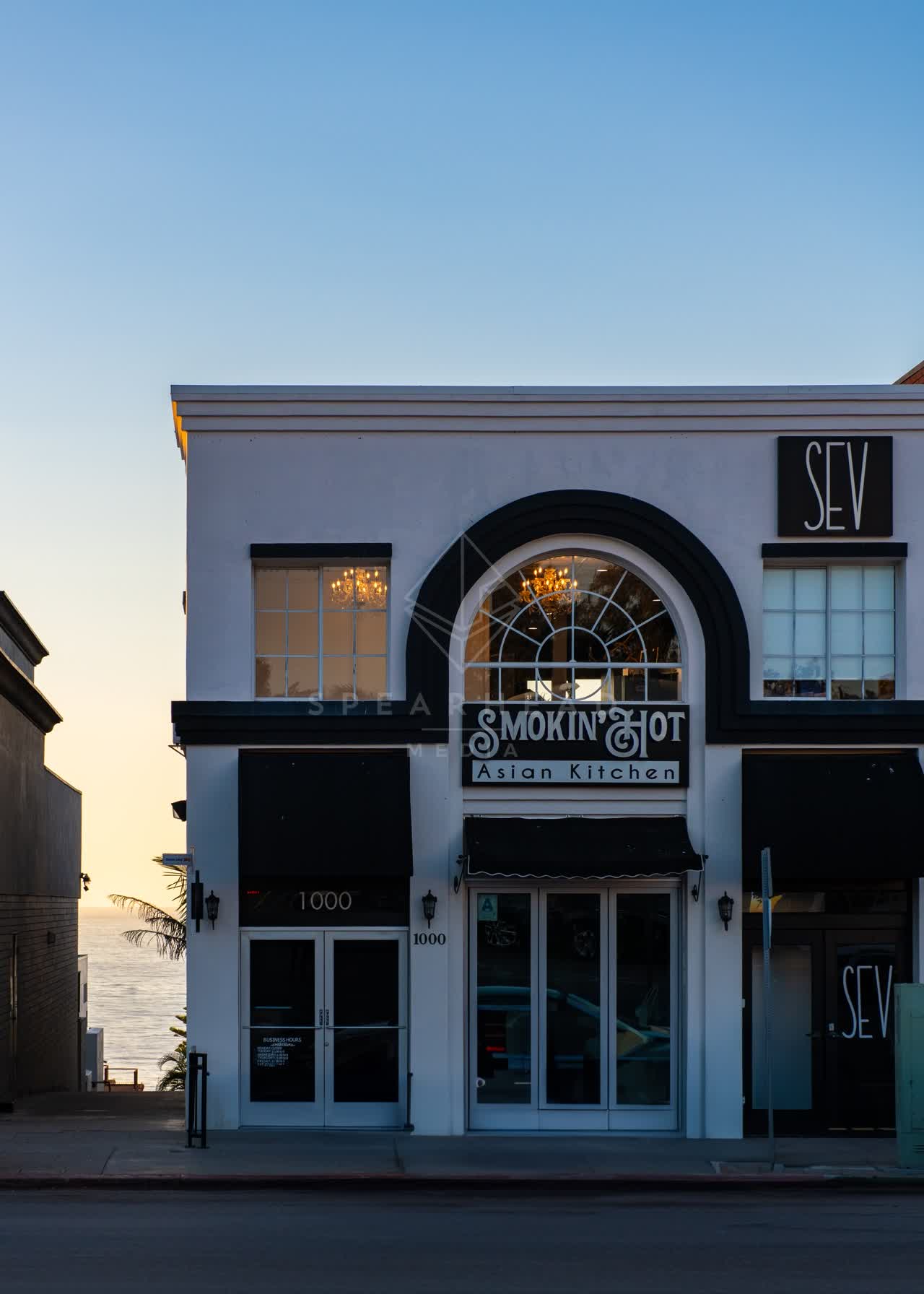 The downtown streets, palm trees and the ocean at Village of La Jolla.