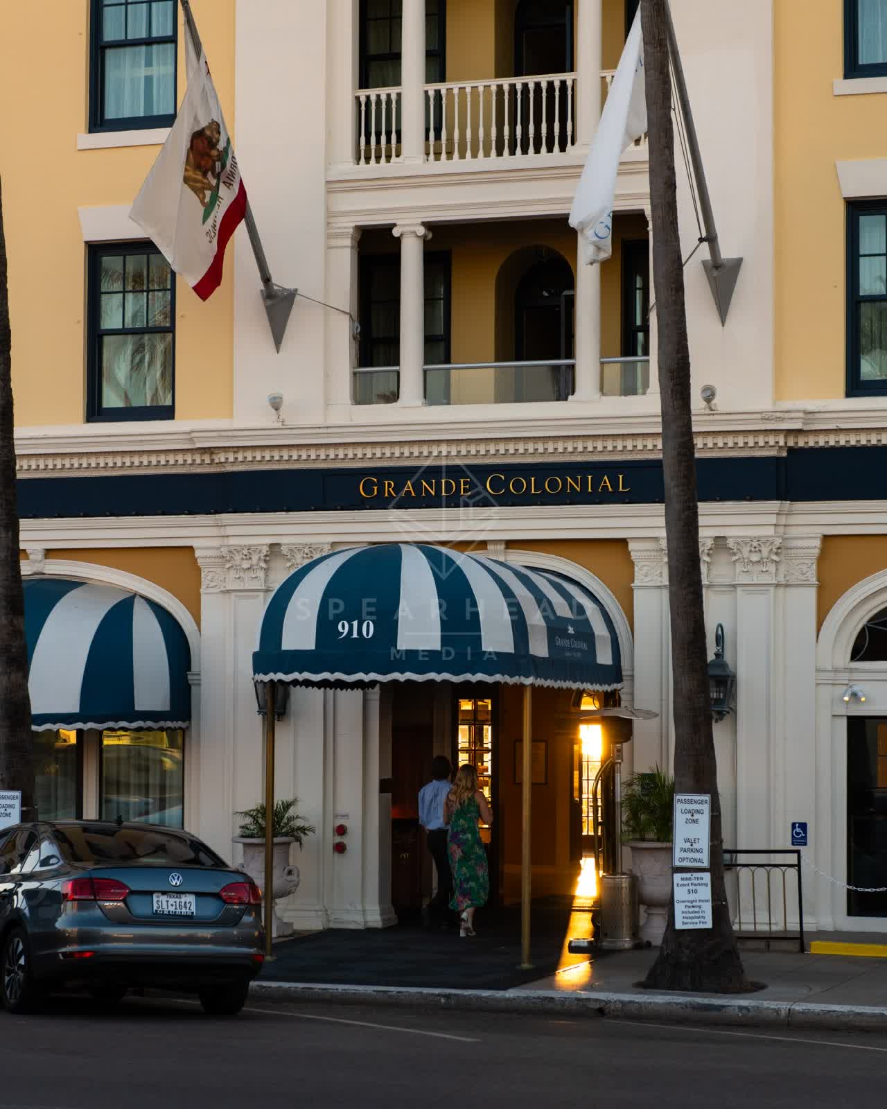 The downtown streets, palm trees and the buildings at Village of La Jolla, with people walking.