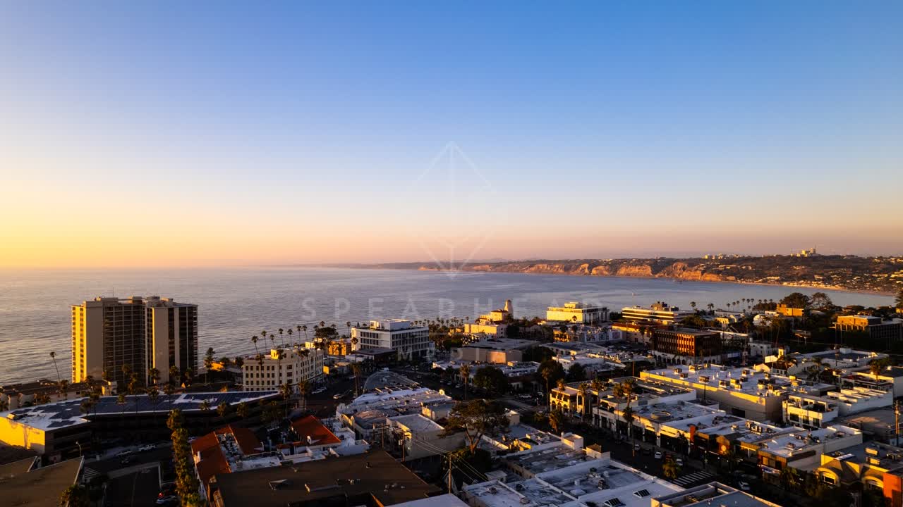 Aerial view of the downtown streets, palm trees and the ocean at La Jolla Cove.