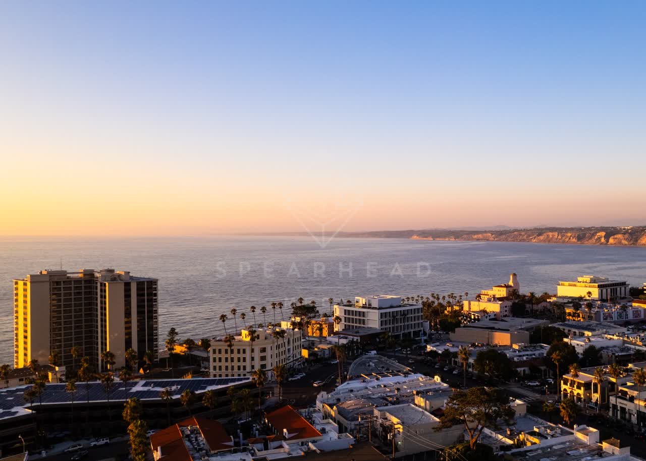 Aerial view of the downtown streets, palm trees and the ocean at La Jolla Cove.