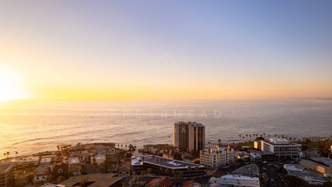 Aerial view of the downtown streets, palm trees and the ocean at La Jolla Cove.