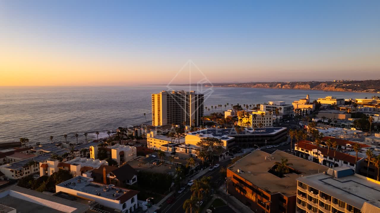 Aerial view of the downtown streets, palm trees and the ocean at La Jolla Cove.