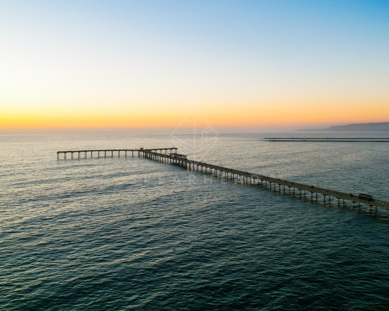 Aerial view of the beach, the pier and the ocean in Ocean Beach.