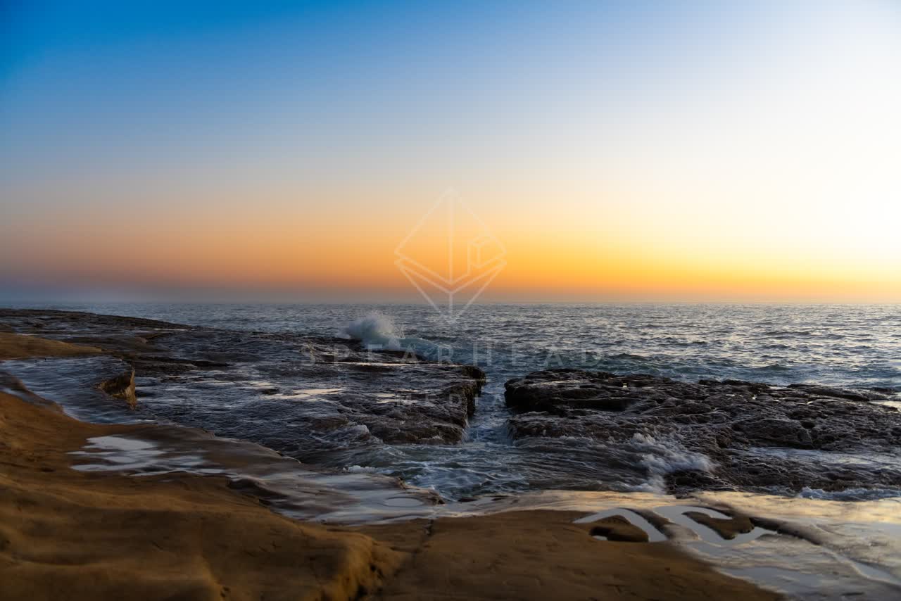 The cliffs, the surf and the ocean in Ocean Beach.